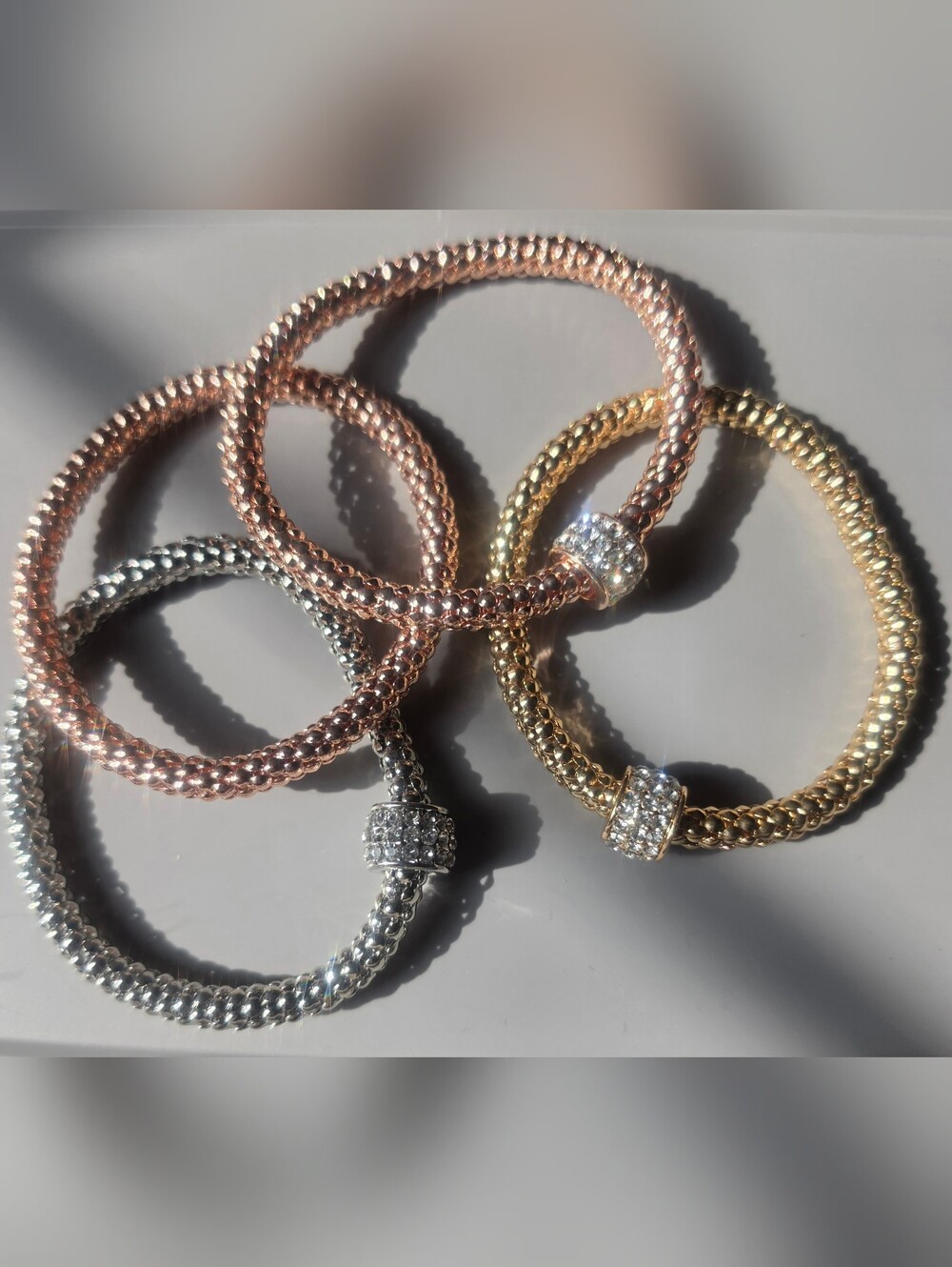 Stackable rope bangle bracelet set features pavé white crystal accents